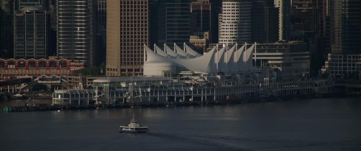 Tall buildings are near the shore