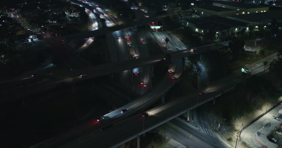 Aerial view of cars driving on a highway during the night