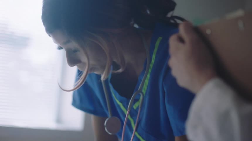 Nurse in a hospital with stethoscope hanging on the research