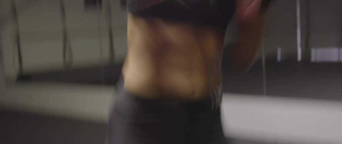 A woman is shadow boxing