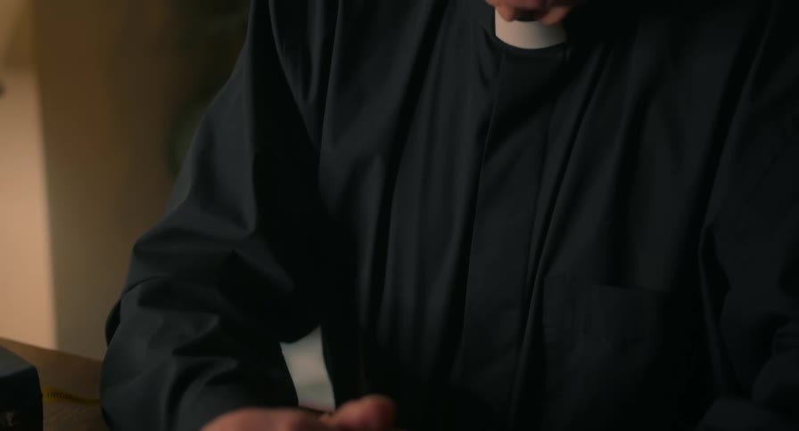 Man praying with his bible and eyeglasses on the table