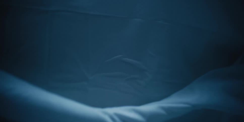 A white dress being moved around and dragging on the floor