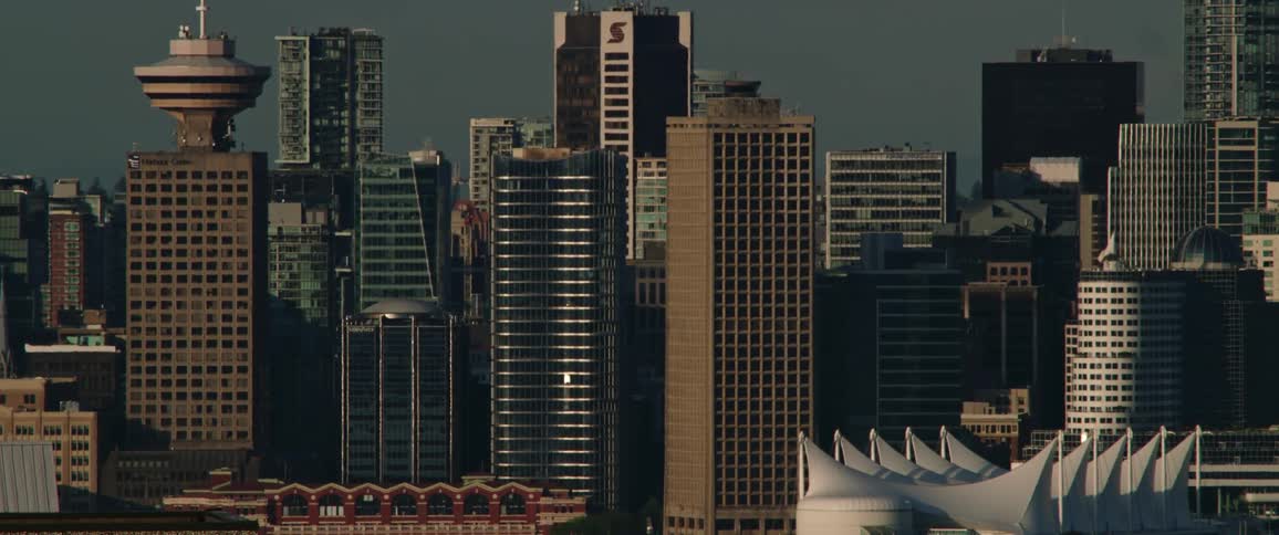 A still shot of a downtown city skyline with lots of tall buildings