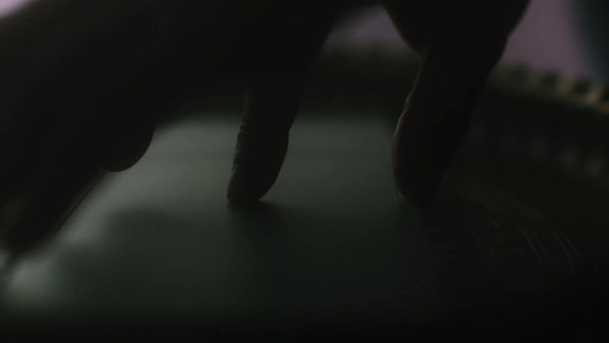 Human fingers gesturing over a surface