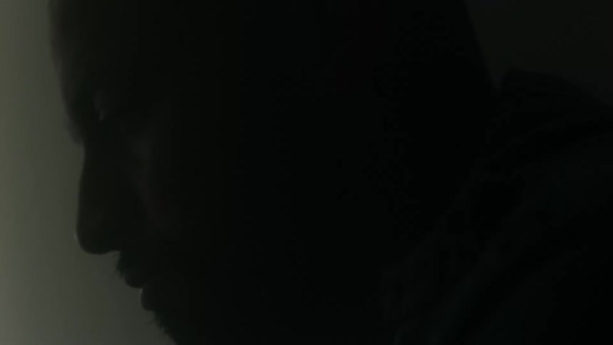 Silhouette of a bearded mans face