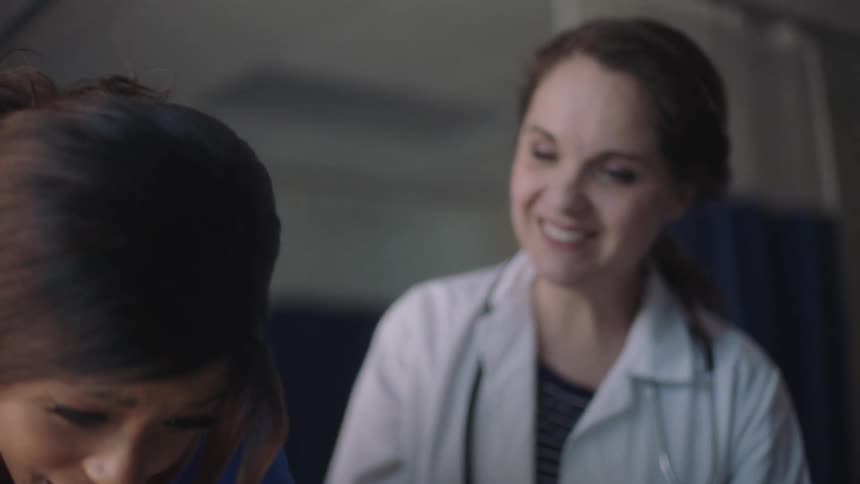 Two women working at a doctors office together
