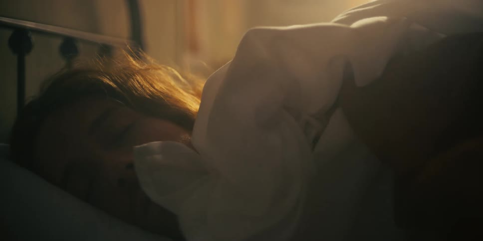 Close up view of a man sleeping in his bed