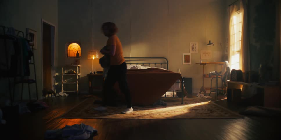 A man cleans up his bedroom
