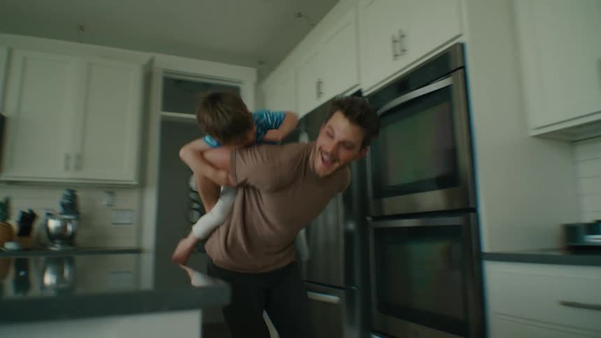 Father and Son Share a Silly, Playful Moment on a Piggyback Ride