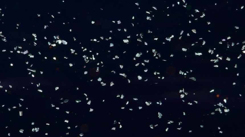 Small rocks floating and orbiting on outer space like a meteorite field