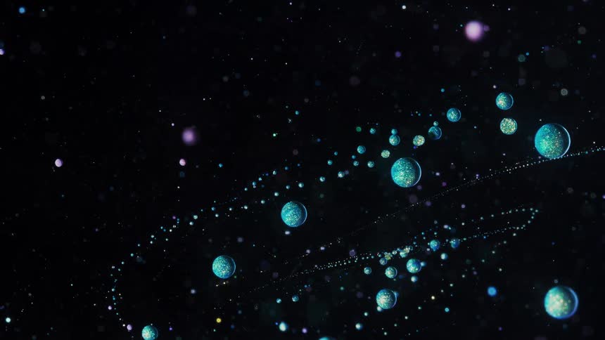 Abstract sparkly spheres moving around slowly in orbit in a dark night sky