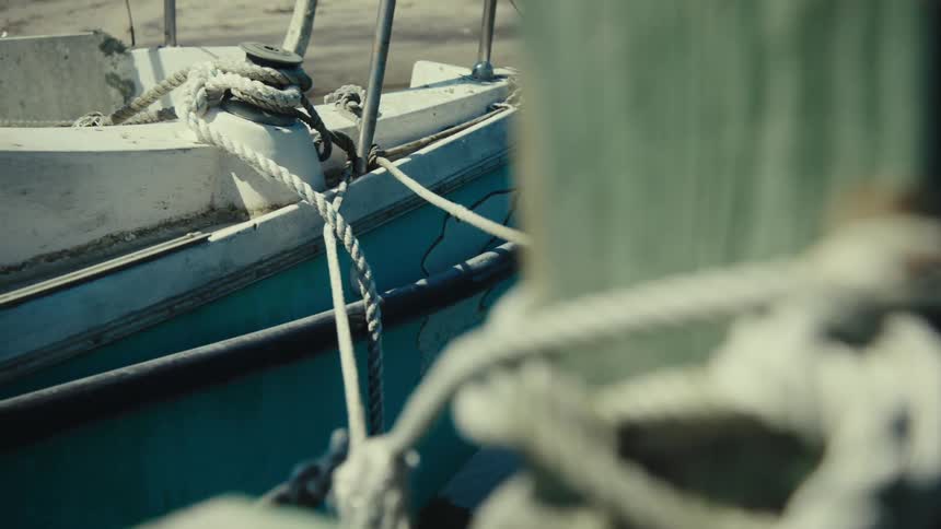 A boat tied to a moor with a thick rope