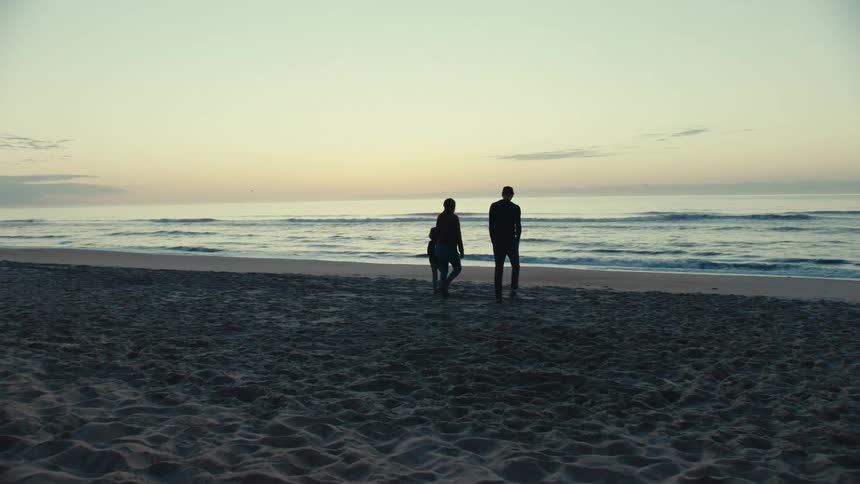 People walk and run on the beach