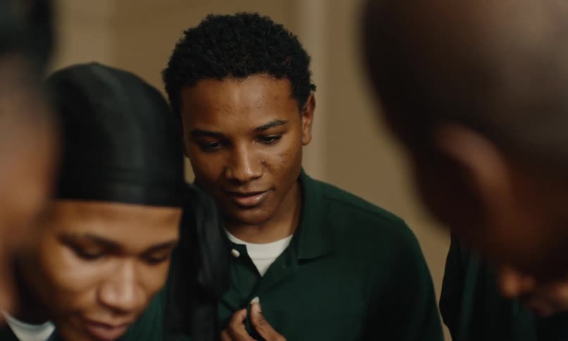 A small group of teenage boys huddled together