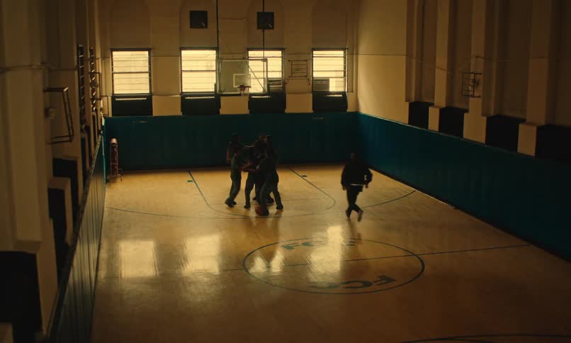 People are playing a game of basketball