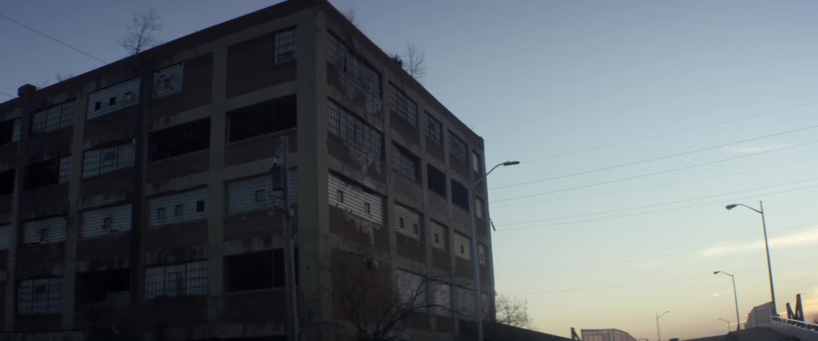 A building is dark at sunset