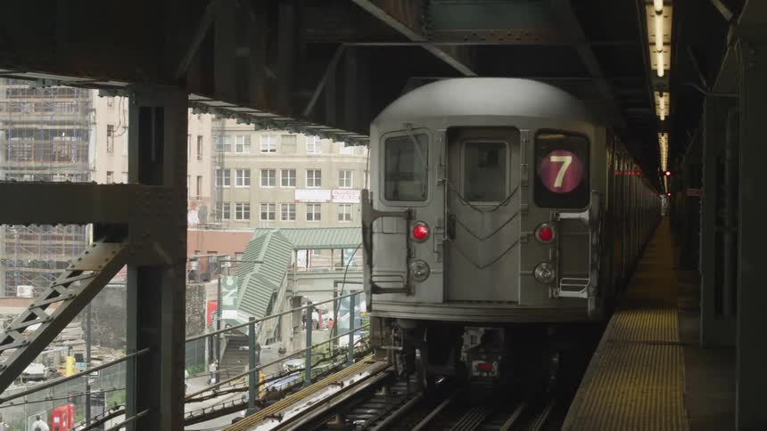 A subway train departing the station