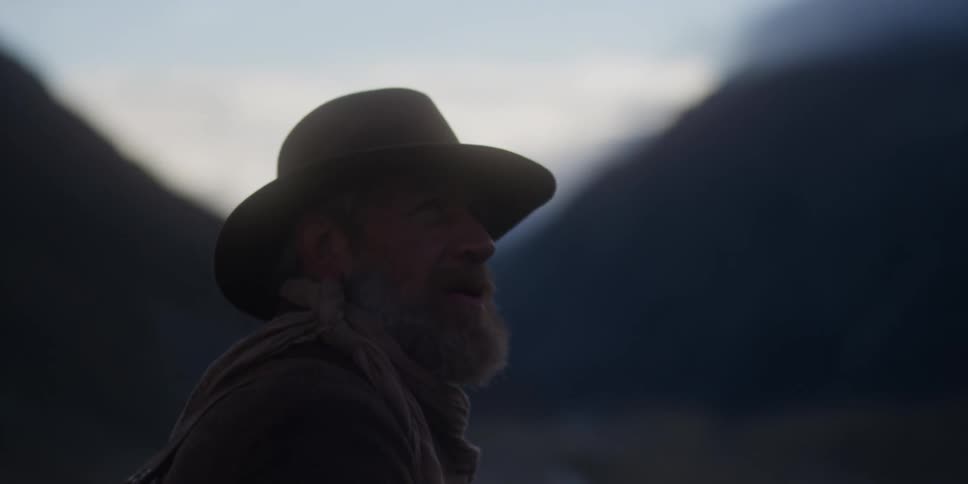 Close up view of a man hiking in the wilderness