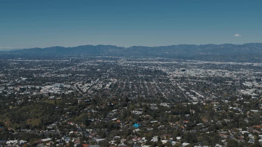 A push-in establishing shot of Van Nuys and the San Fernando Valley