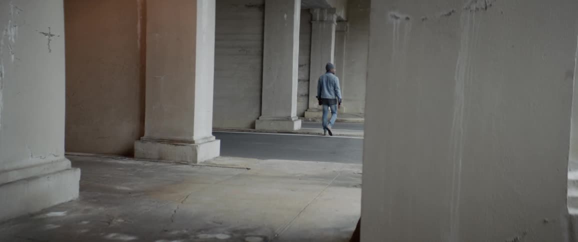 A man is walking outside during daytime