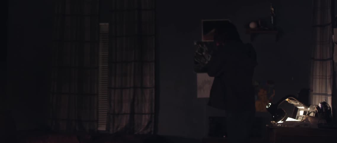 Man kicks the wall and has a nervous break down in his dimly lit room