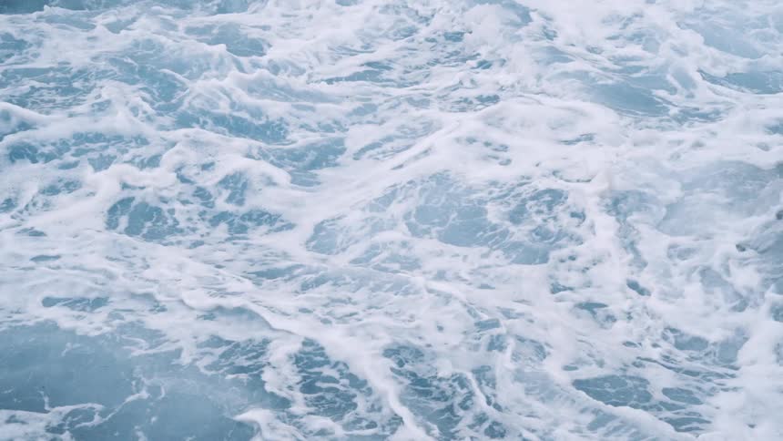 Close up view of ocean waves moving fastly