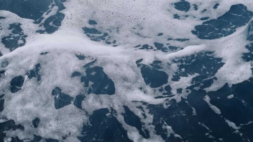 A view of ocean waves moving fast is displayed