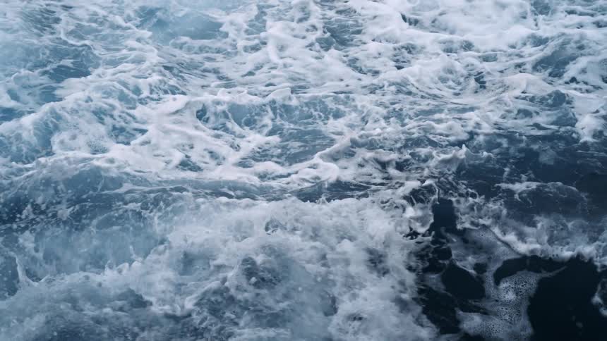 Close up view of waves crashing into each other in the ocean