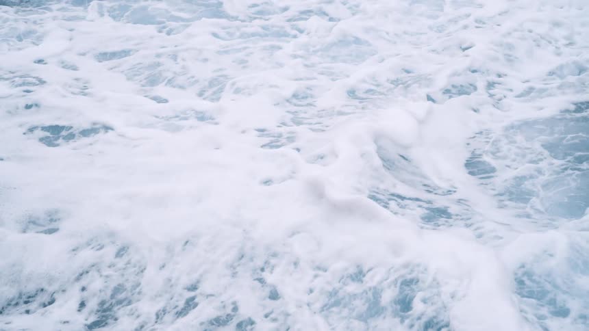 Close up view of ocean waves at midday
