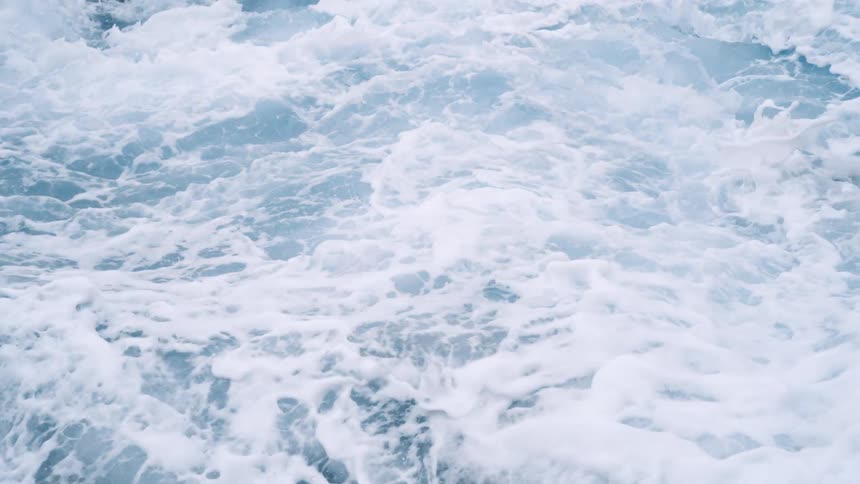 Close up view of ocean waves crashing into each other