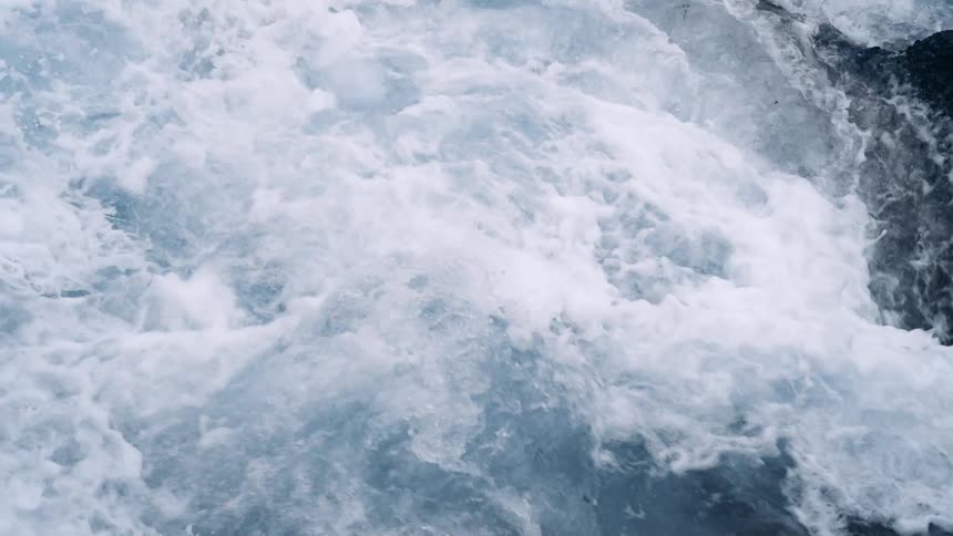 A close up view of ocean waves moving fast