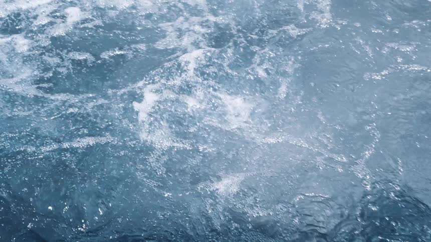 Body of foamy water and waves