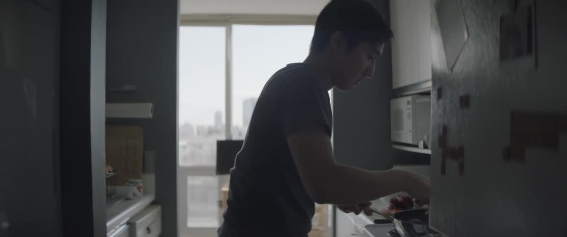 A man is mixing food and preparing a meal