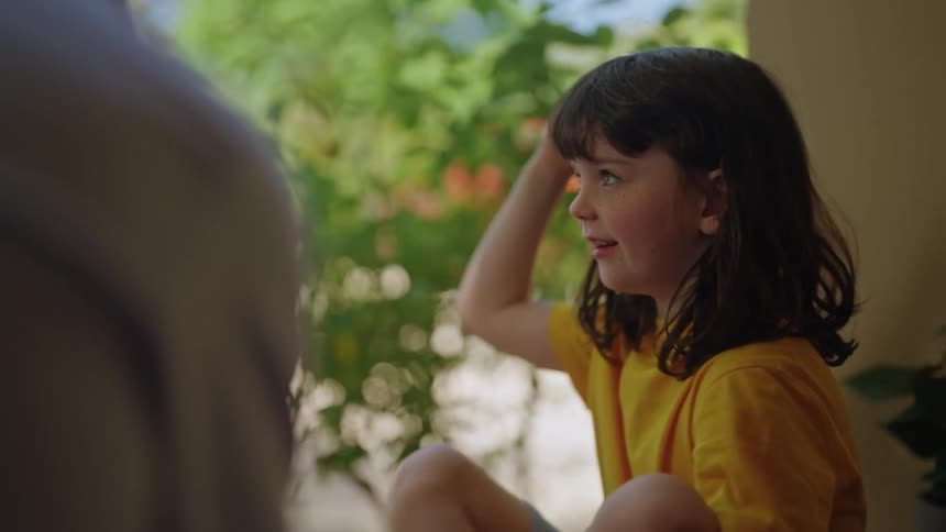 A girl chatting with her father