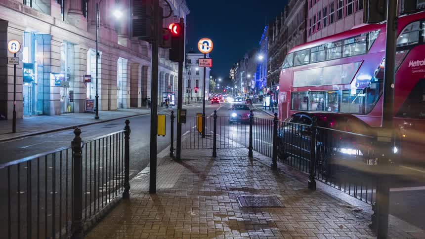 A time lapse of a city street shows a dizzying progression of automobiles and pedestrians