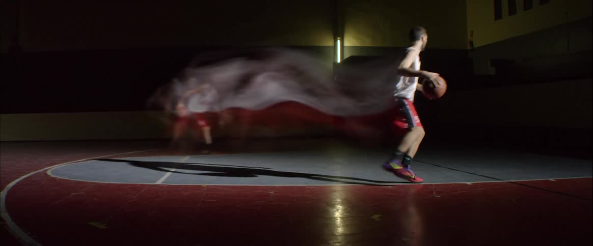 Man dribbles and shoots basketball showing previous movement