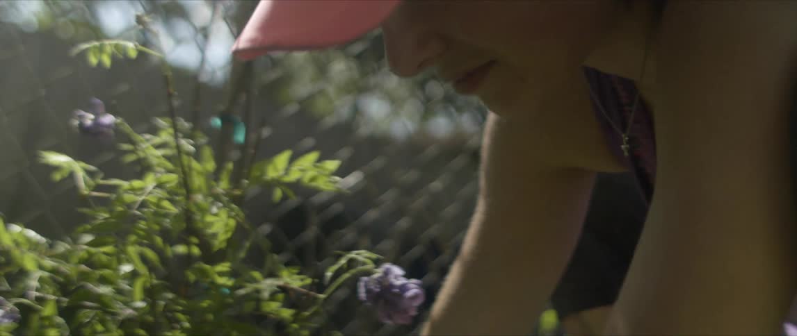 A woman is working in a garden