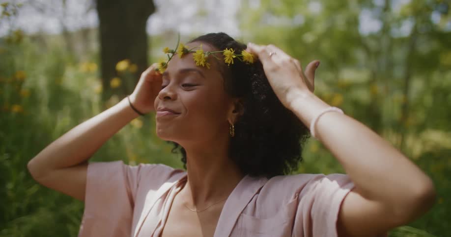 The view is of a portrait of a woman that is outdoors