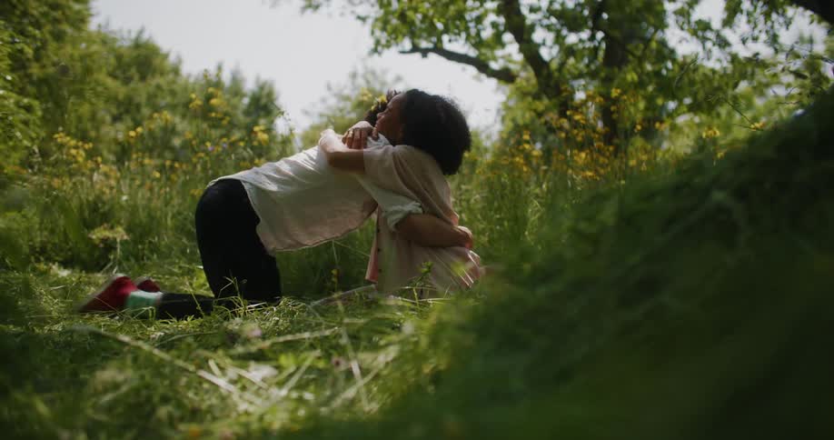 Man and woman are hugging outdoors during spring