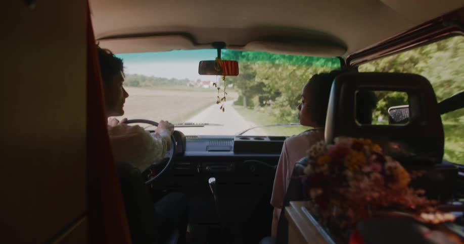 Man and woman are driving in a car together