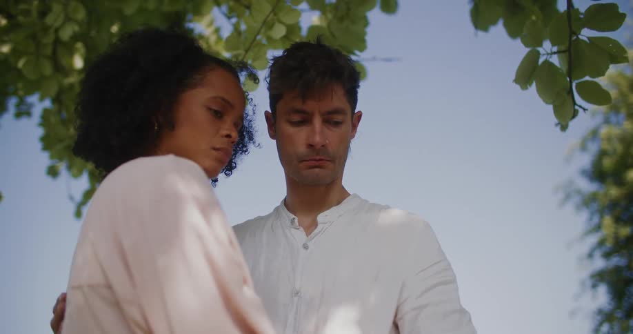 Man and woman are standing outdoors together