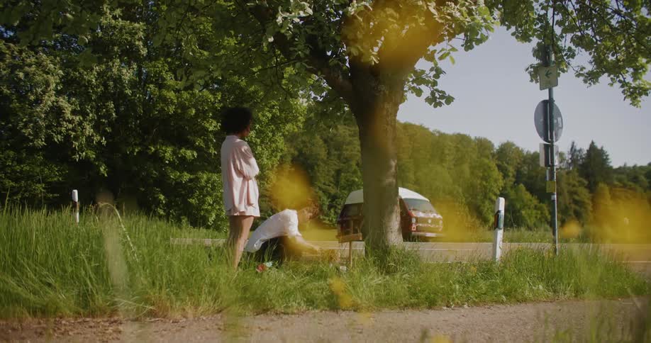 The view is of a portrait of two people that are outdoors