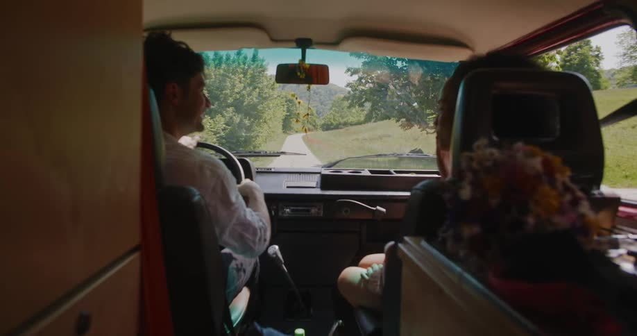 Man and woman are driving in a car together