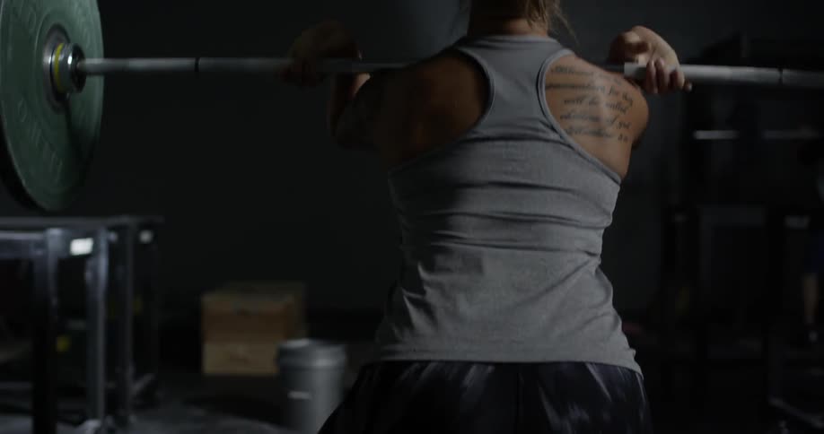 A person dead lifts a large weight