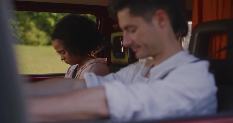 Man and woman are sitting in a car together