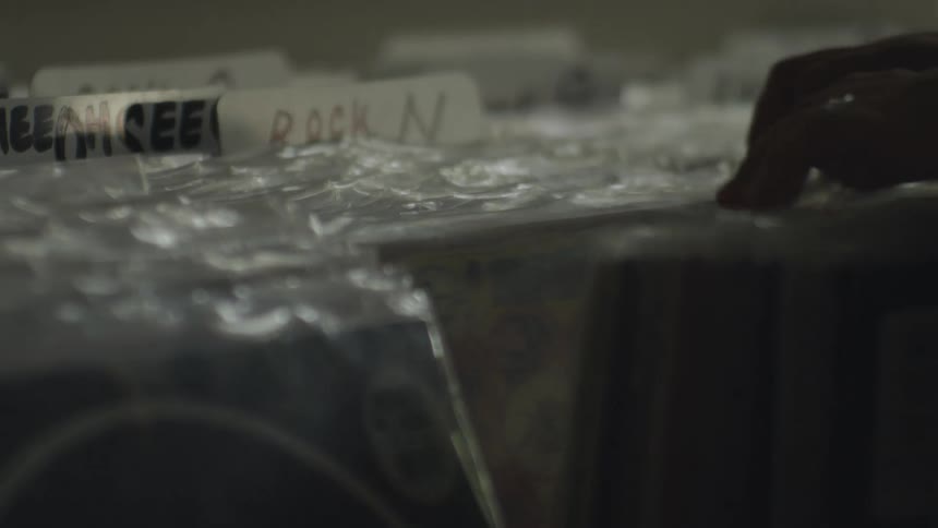 A customer is searching through the records
