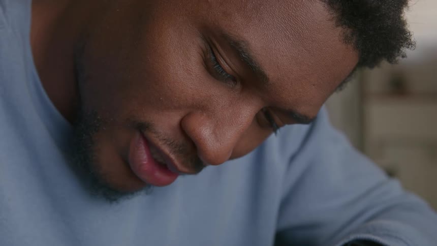 Close up view of a person writing on a notepad