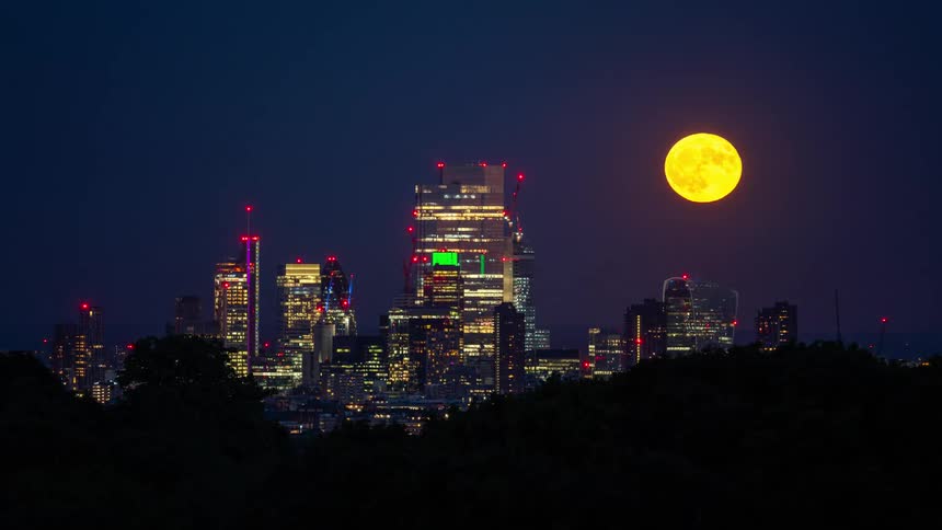 A computer generated image shows a time lapse of a city at night with the moon moving and the city lights neon colors