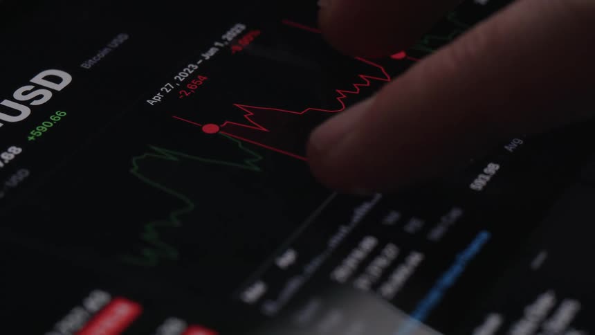 A person traces the graph on his tablet