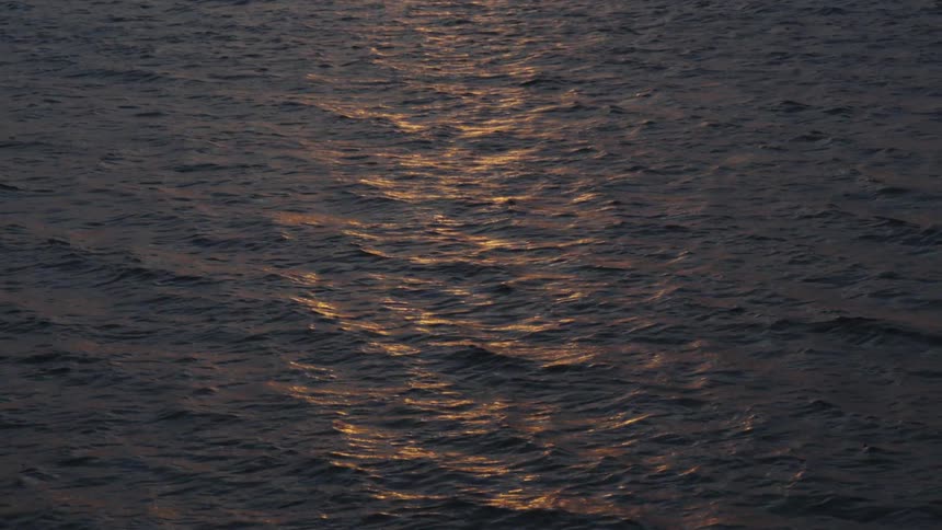 The sunlight reflects on the ocean